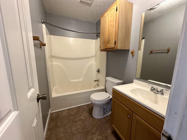 full bathroom with toilet, tub / shower combination, a textured ceiling, vanity, and tile patterned floors