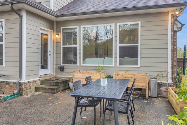 view of patio / terrace with entry steps and outdoor dining space