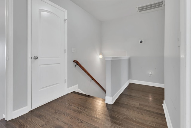 interior space with wood finished floors, visible vents, and baseboards