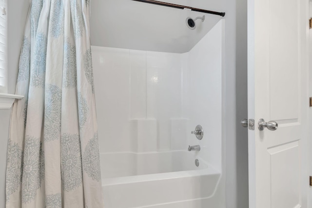 full bathroom with shower / bath combo with shower curtain