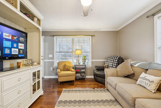 living room featuring dark wood-style floors, baseboards, a ceiling fan, and crown molding