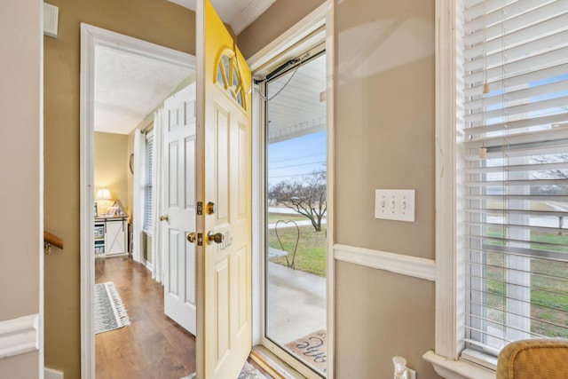 doorway to outside featuring wood finished floors