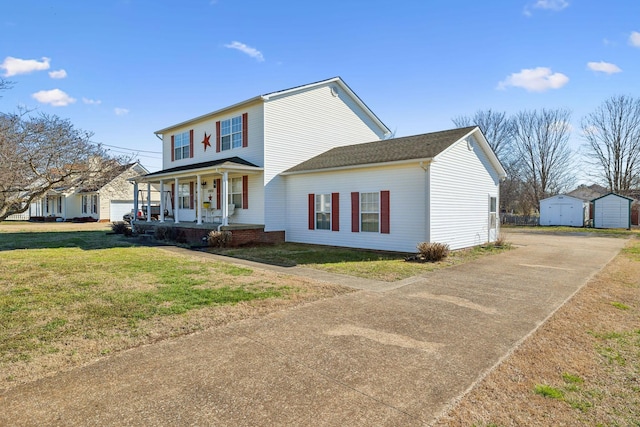 view of front facade with covered porch and a front lawn