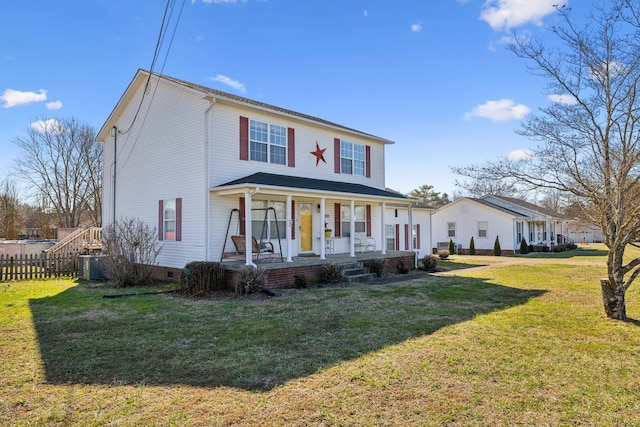 view of front of house with covered porch, crawl space, a front yard, and fence