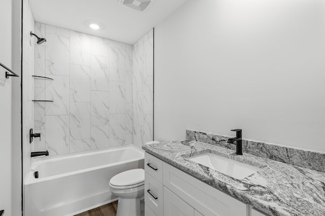 bathroom with toilet, visible vents, tub / shower combination, and vanity