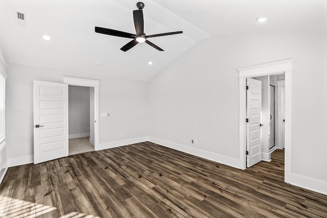 unfurnished bedroom with dark wood-style floors, visible vents, vaulted ceiling, ceiling fan, and baseboards