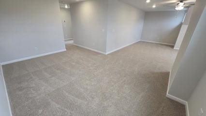 empty room with a ceiling fan, recessed lighting, light carpet, and baseboards