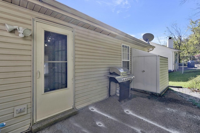 view of patio featuring a grill