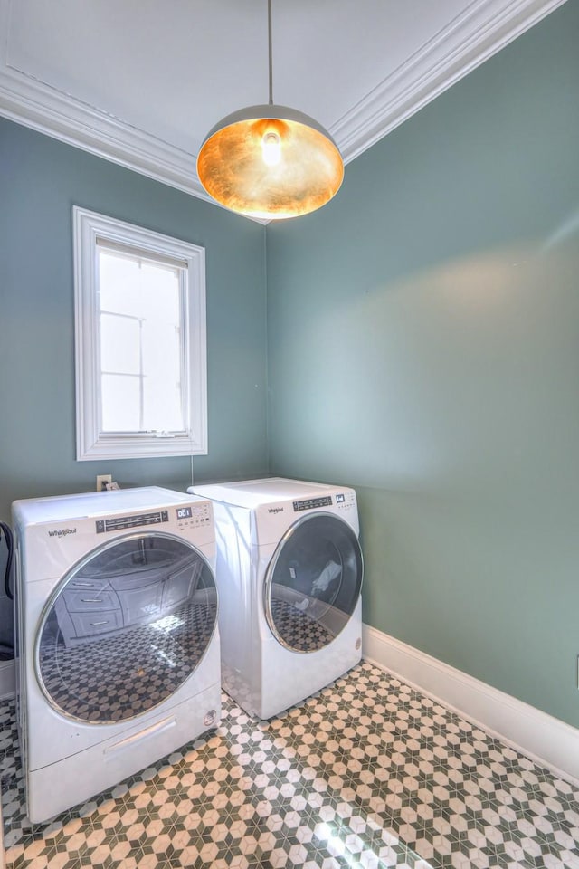 washroom with laundry area, baseboards, ornamental molding, tile patterned floors, and washing machine and dryer