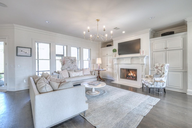 living area featuring crown molding, a fireplace with flush hearth, dark wood-type flooring, a chandelier, and baseboards