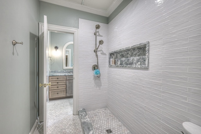 full bathroom featuring a stall shower, ornamental molding, and vanity