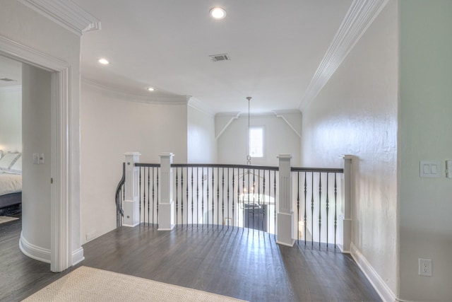 interior space featuring dark wood-style floors, ornamental molding, visible vents, and recessed lighting