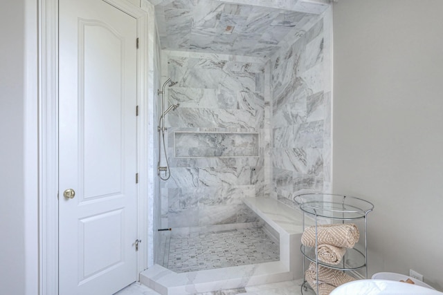 full bath with a marble finish shower