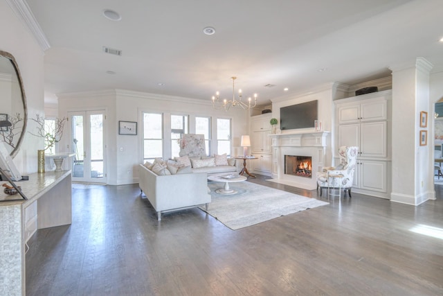 living room featuring a fireplace with flush hearth, dark wood-style flooring, visible vents, and a healthy amount of sunlight