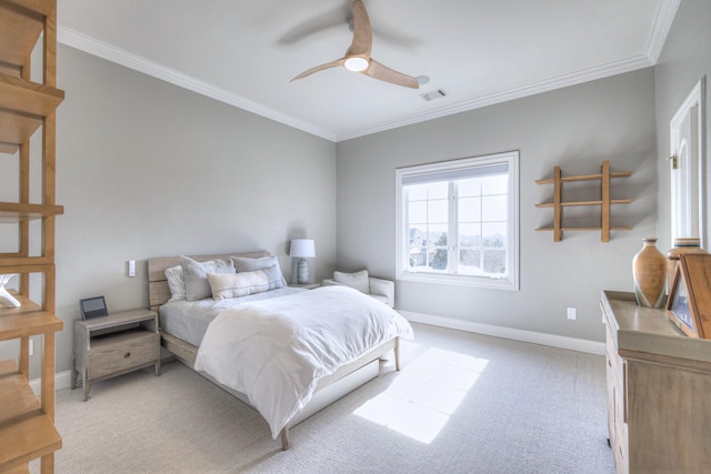 bedroom with ceiling fan, light colored carpet, visible vents, baseboards, and crown molding