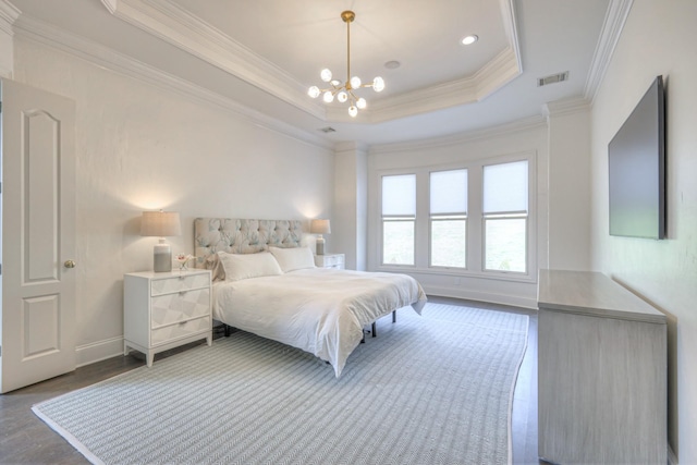 bedroom featuring baseboards, visible vents, a raised ceiling, crown molding, and a notable chandelier