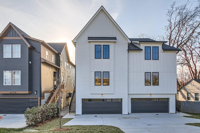 605A Morrow Rd, Nashville, TN 37209 - modern inspired farmhouse featuring stairs, driveway, board and batten siding, and an attached garage