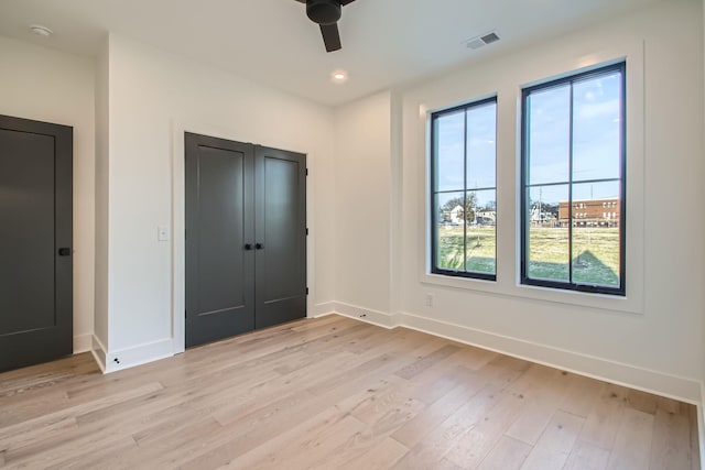 605A Morrow Rd, Nashville, TN 37209 - unfurnished bedroom with a ceiling fan, visible vents, light wood-style flooring, and baseboards