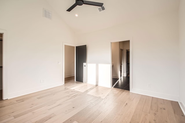 605A Morrow Rd, Nashville, TN 37209 - unfurnished bedroom with light wood-type flooring, high vaulted ceiling, baseboards, and visible vents