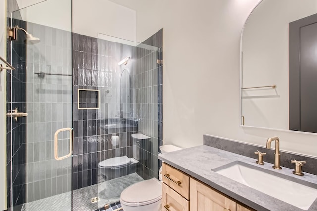 605A Morrow Rd, Nashville, TN 37209 - full bathroom featuring a tile shower, vanity, and toilet