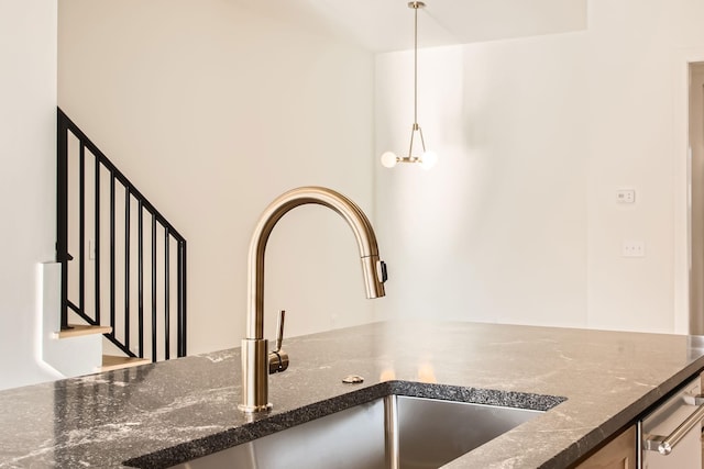 605A Morrow Rd, Nashville, TN 37209 - room details featuring pendant lighting, a sink, and dark stone countertops