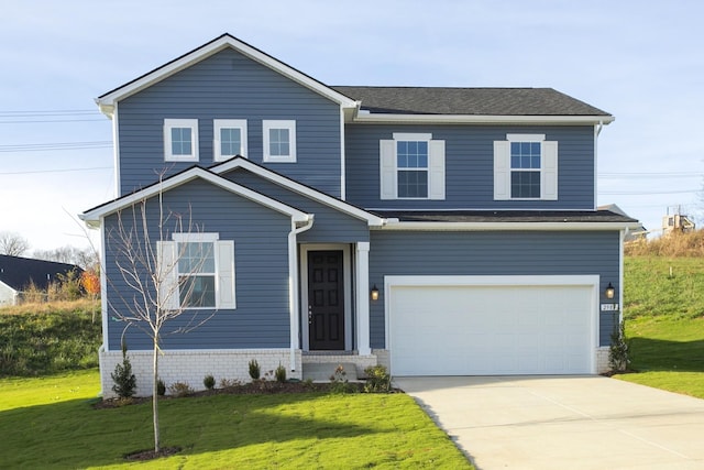 traditional-style house with concrete driveway, a front lawn, and an attached garage