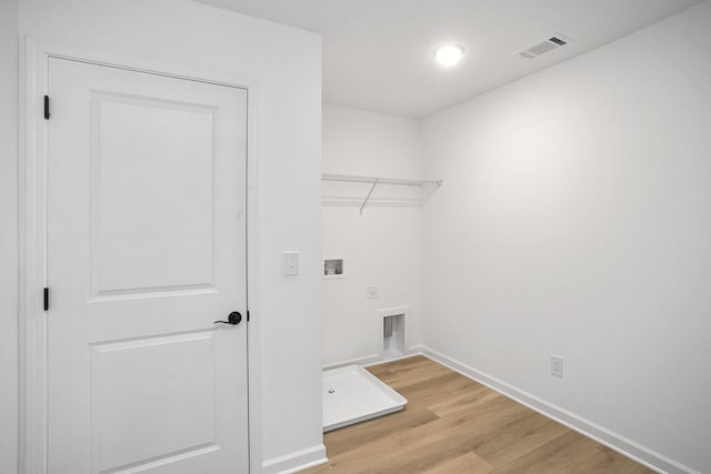 laundry room with washer hookup, visible vents, light wood-style floors, hookup for an electric dryer, and laundry area