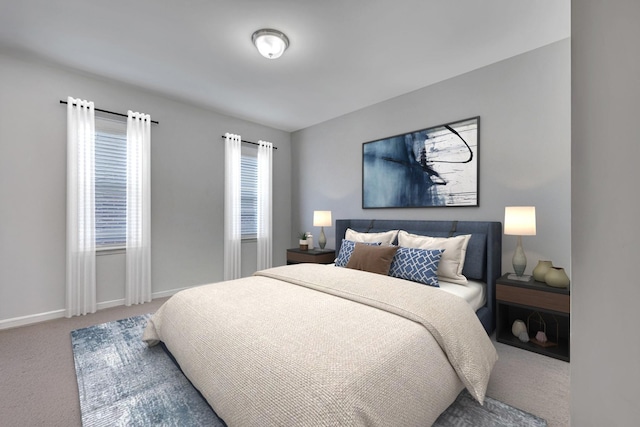 bedroom featuring carpet and baseboards