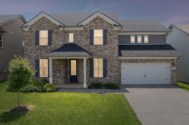 315 Gulfstream Dr, Gallatin, TN 37066 - view of front of house with concrete driveway, a shingled roof, a front lawn, a garage, and brick siding