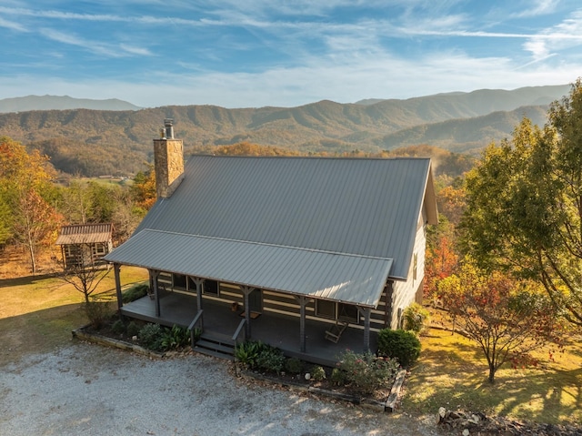 exterior space featuring a mountain view and a porch