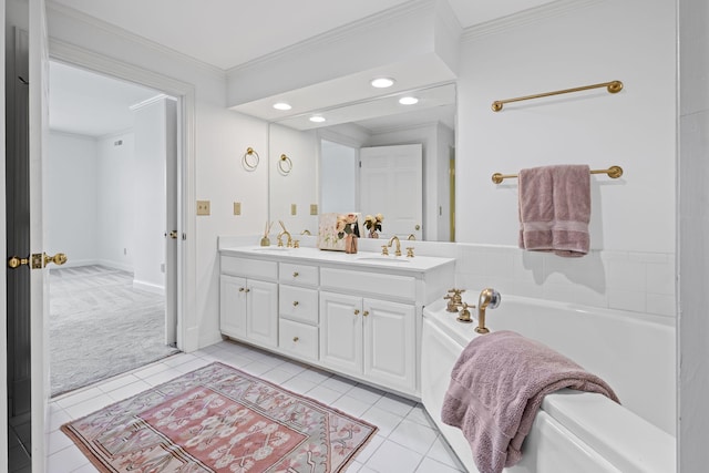 bathroom featuring a garden tub, ornamental molding, and tile patterned flooring