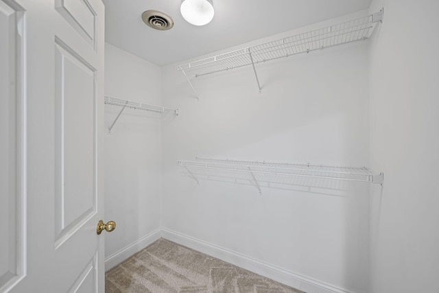 spacious closet featuring carpet floors and visible vents