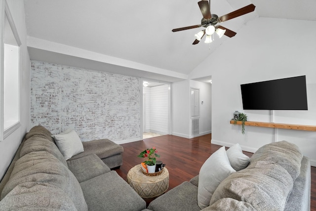 living room with dark wood finished floors, an accent wall, ceiling fan, high vaulted ceiling, and baseboards