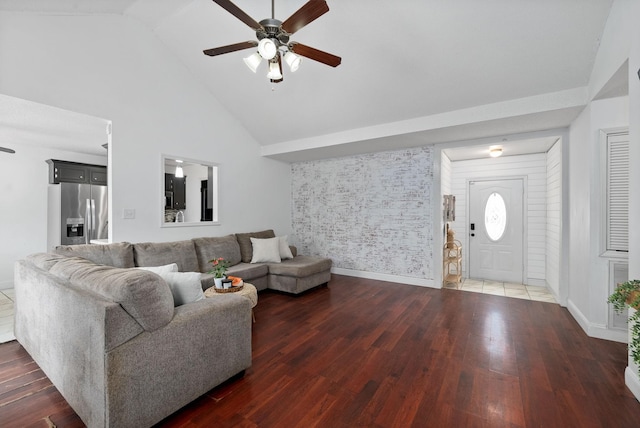 living room with dark wood-style floors, baseboards, high vaulted ceiling, and a ceiling fan