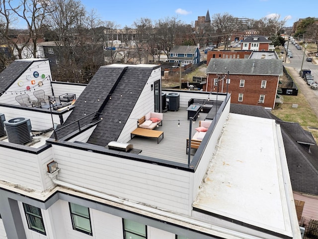 exterior space with a residential view and central AC unit