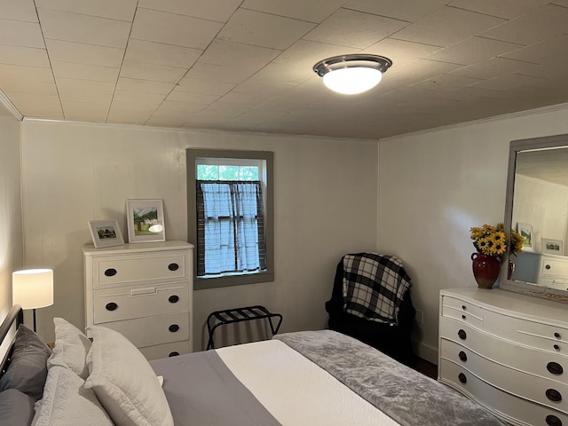 bedroom with crown molding