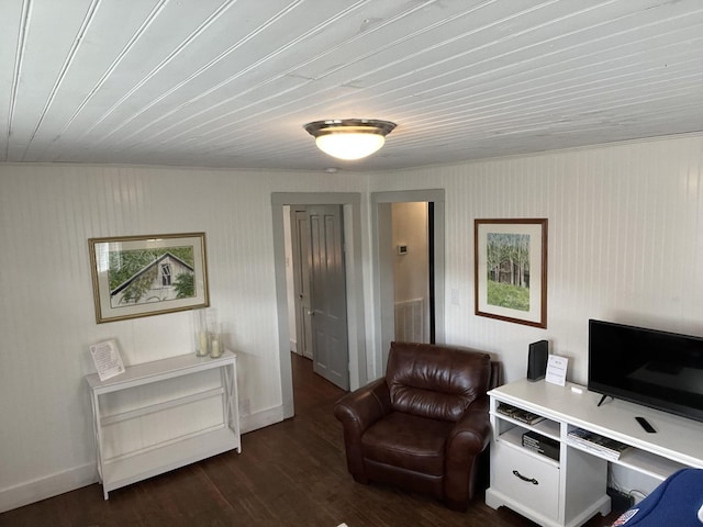 office with dark wood-style flooring and baseboards