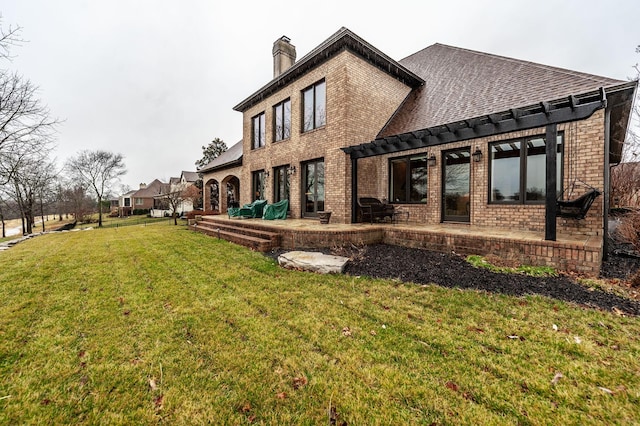 1225 Chloe Dr, Gallatin, TN 37066 - rear view of property with a yard, brick siding, a patio, and a chimney