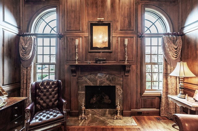 1225 Chloe Dr, Gallatin, TN 37066 - living room with visible vents, plenty of natural light, a premium fireplace, and wood finished floors