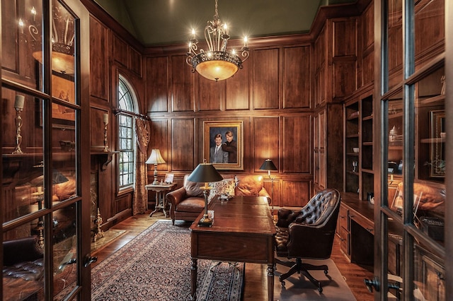 1225 Chloe Dr, Gallatin, TN 37066 - office area featuring a towering ceiling, wooden walls, a chandelier, and wood finished floors