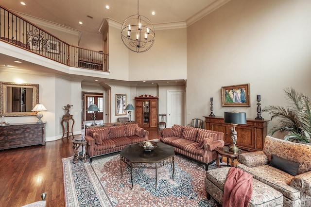 1225 Chloe Dr, Gallatin, TN 37066 - living room featuring a notable chandelier, dark wood finished floors, a towering ceiling, ornamental molding, and baseboards