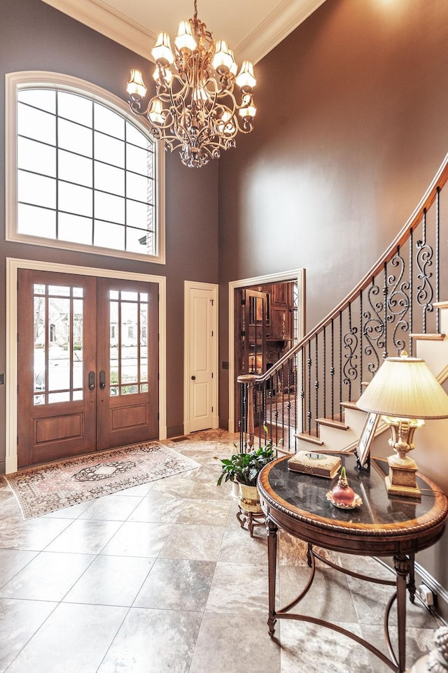 1225 Chloe Dr, Gallatin, TN 37066 - foyer entrance featuring a towering ceiling, stairway, crown molding, and french doors