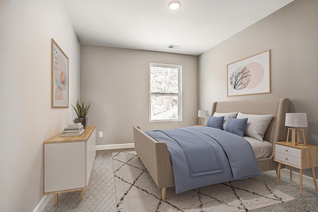 bedroom featuring light carpet, baseboards, and visible vents