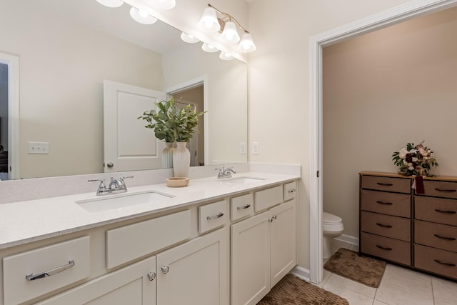 full bathroom with tile patterned flooring, a sink, toilet, and double vanity