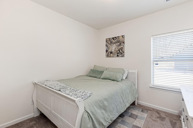 bedroom with carpet and baseboards