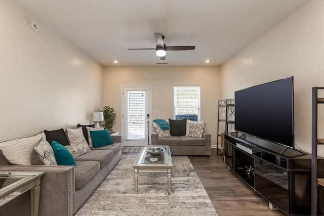 living room featuring recessed lighting, ceiling fan, baseboards, and wood finished floors