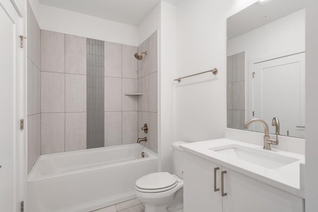 full bath featuring toilet, tile patterned flooring, tub / shower combination, and vanity