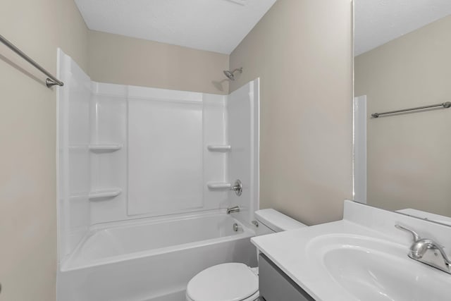 full bath with a textured ceiling, toilet, vanity, and shower / bathing tub combination