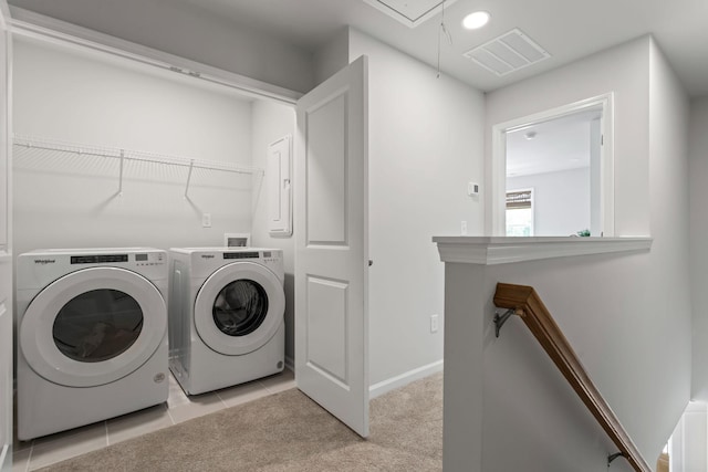 laundry area with light carpet, laundry area, attic access, visible vents, and washer and dryer