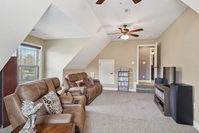 living room with light colored carpet, a ceiling fan, baseboards, vaulted ceiling, and visible vents